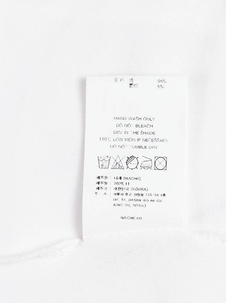 White Nache slim fit long sleeve top with a distorted black typographic print and flared cuffs - view 3