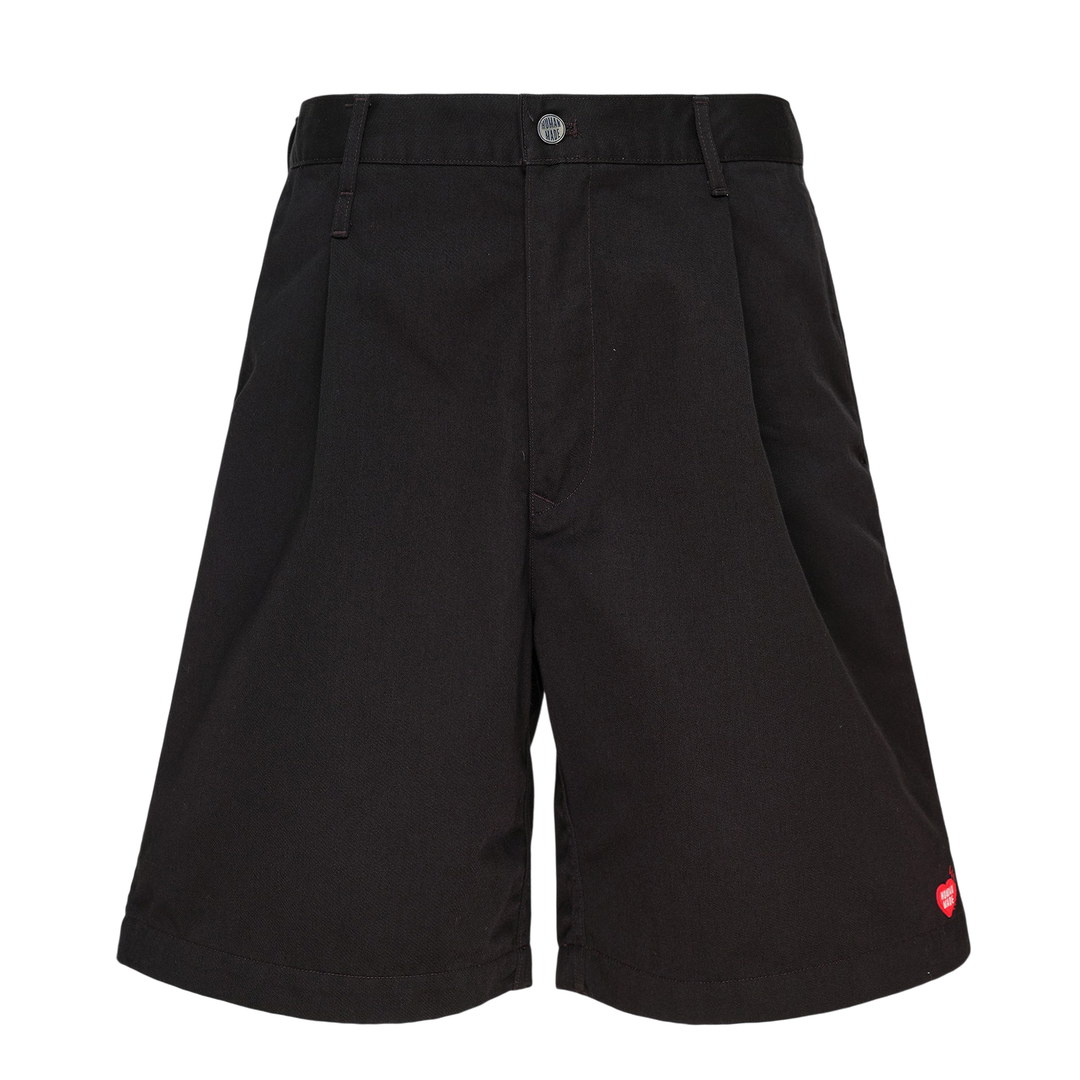 Human Made Skater Shorts in black with embroidered heart-and-arrow logo near the hem and yellow woven brand label at the waistband