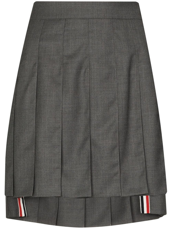 Thom Browne medium grey wool dropped back pleated midi skirt with RWB stripe trim at hem and side buckle waistband