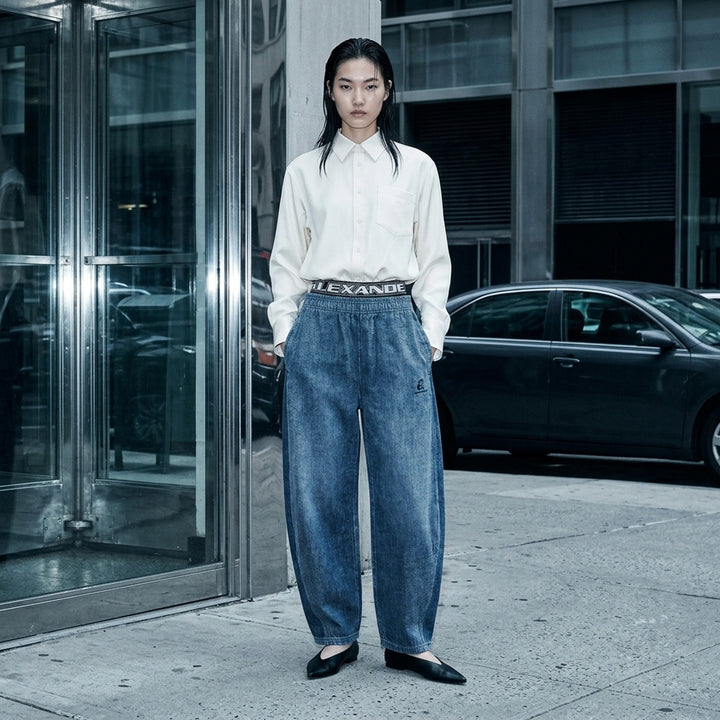 Alexander Wang brushed denim sweatpants in faded blue with a layered logo elastic waistband and curved balloon leg - lifestyle