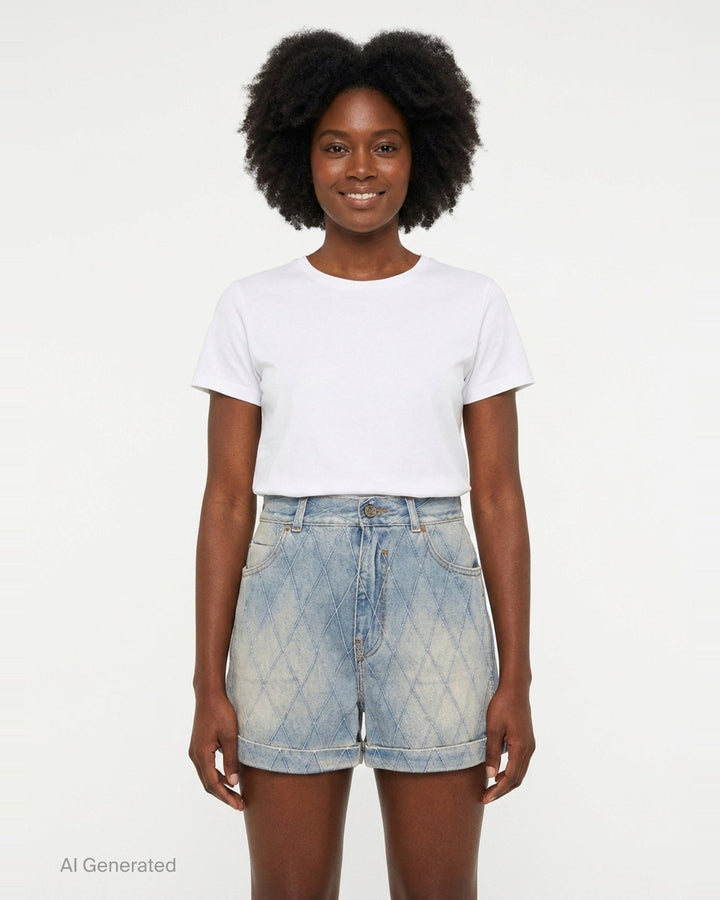 Balmain light blue acid-wash denim shorts with allover diamond quilted stitching, rolled cuffs, five-pocket design, and gold-tone logo button closure - front