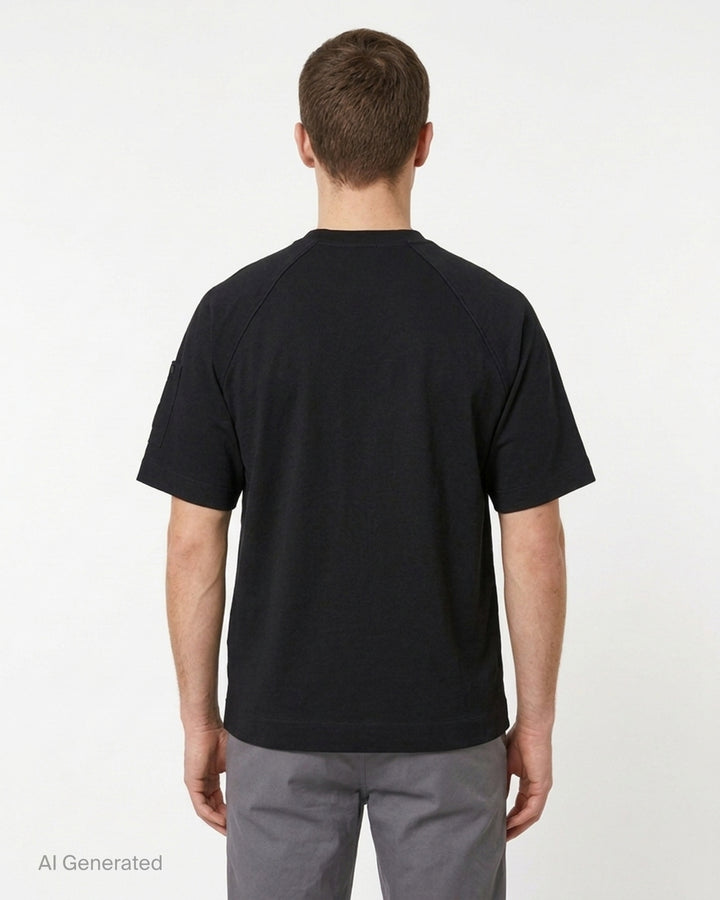 C.P. Company black mercerized cotton jersey raglan t-shirt with snap-fastened sleeve pocket and lens badge, front view - back