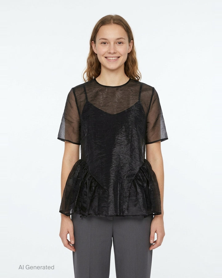 Cecilie Bahnsen Liquid Myrtia short-sleeve peplum top in black crinkled organza with sheer sleeves and gathered ruffle hem, photographed flat on a white background - front