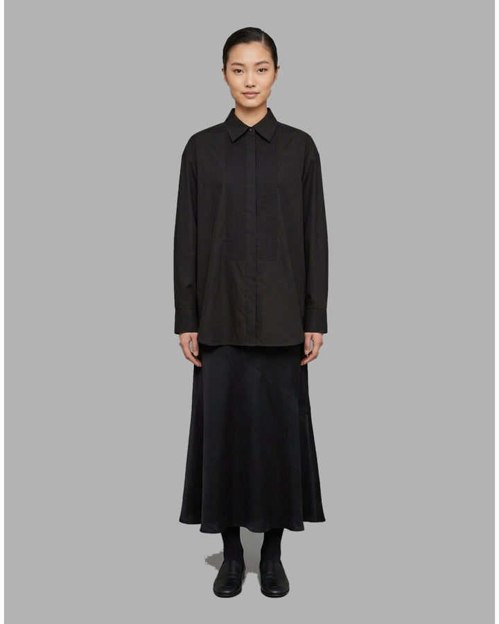 Ivory matte acetate-mix maxi skirt with a diagonal seam and flared hem, shown from the front - front