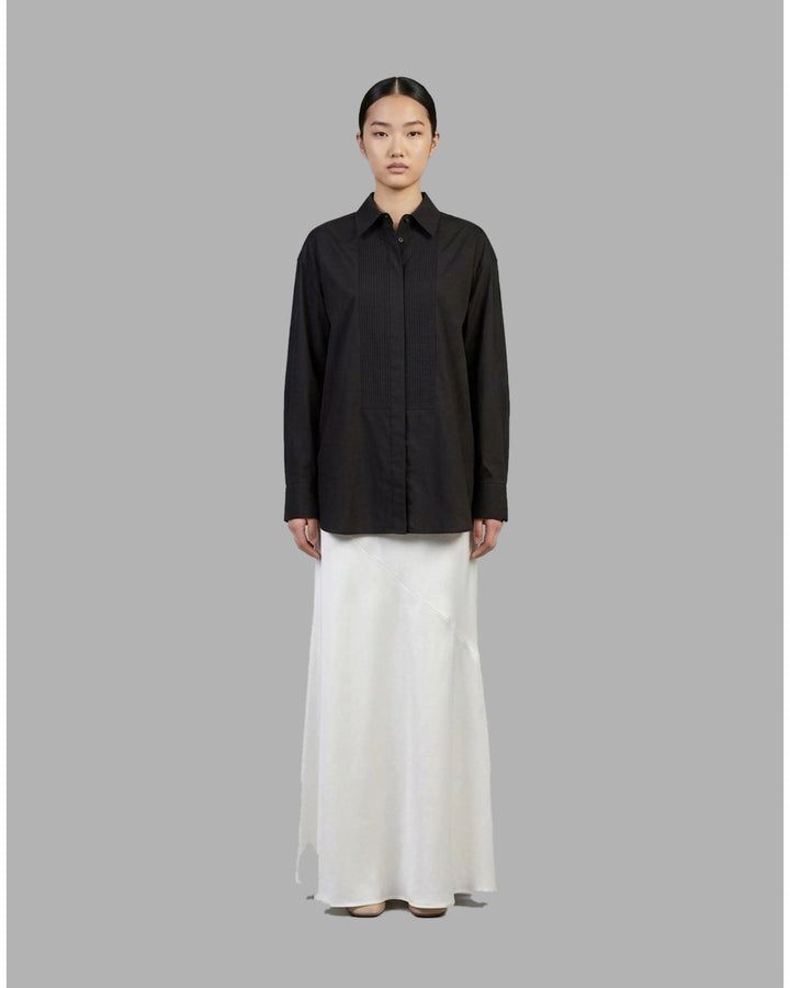 Ivory matte acetate-mix maxi skirt with a diagonal seam and flared hem, shown from the front - front