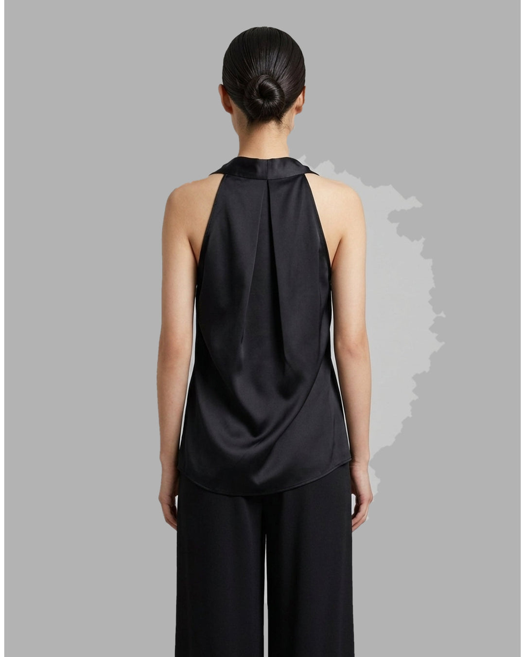 Black sleeveless satin wrap top with a V-neckline, tie waist and asymmetric draped hem from Club21 Collection - back