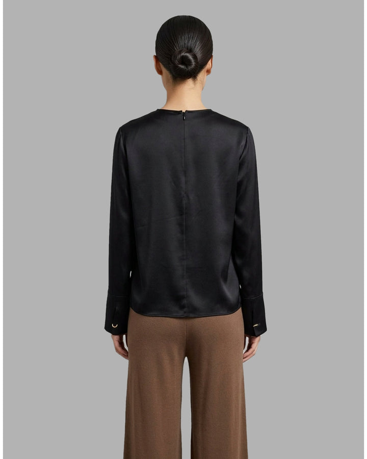 Black matte satin long-sleeve blouse with crew neckline and wide cuffs, shown flat from the front - back
