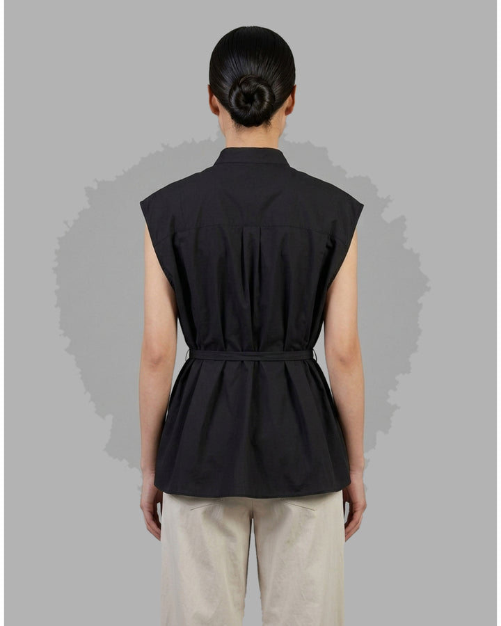 Black sleeveless cotton shirt with mandarin collar, pleated bib front and self-tie waist belt - back