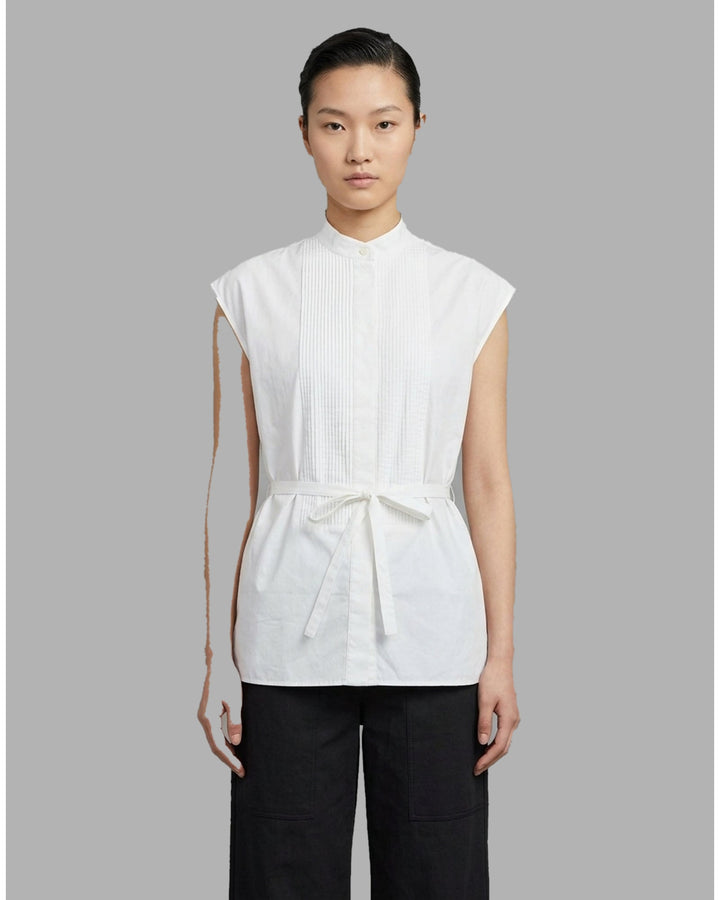 Black sleeveless cotton shirt with pintucked bib front, mandarin collar and self-fabric waist tie - front