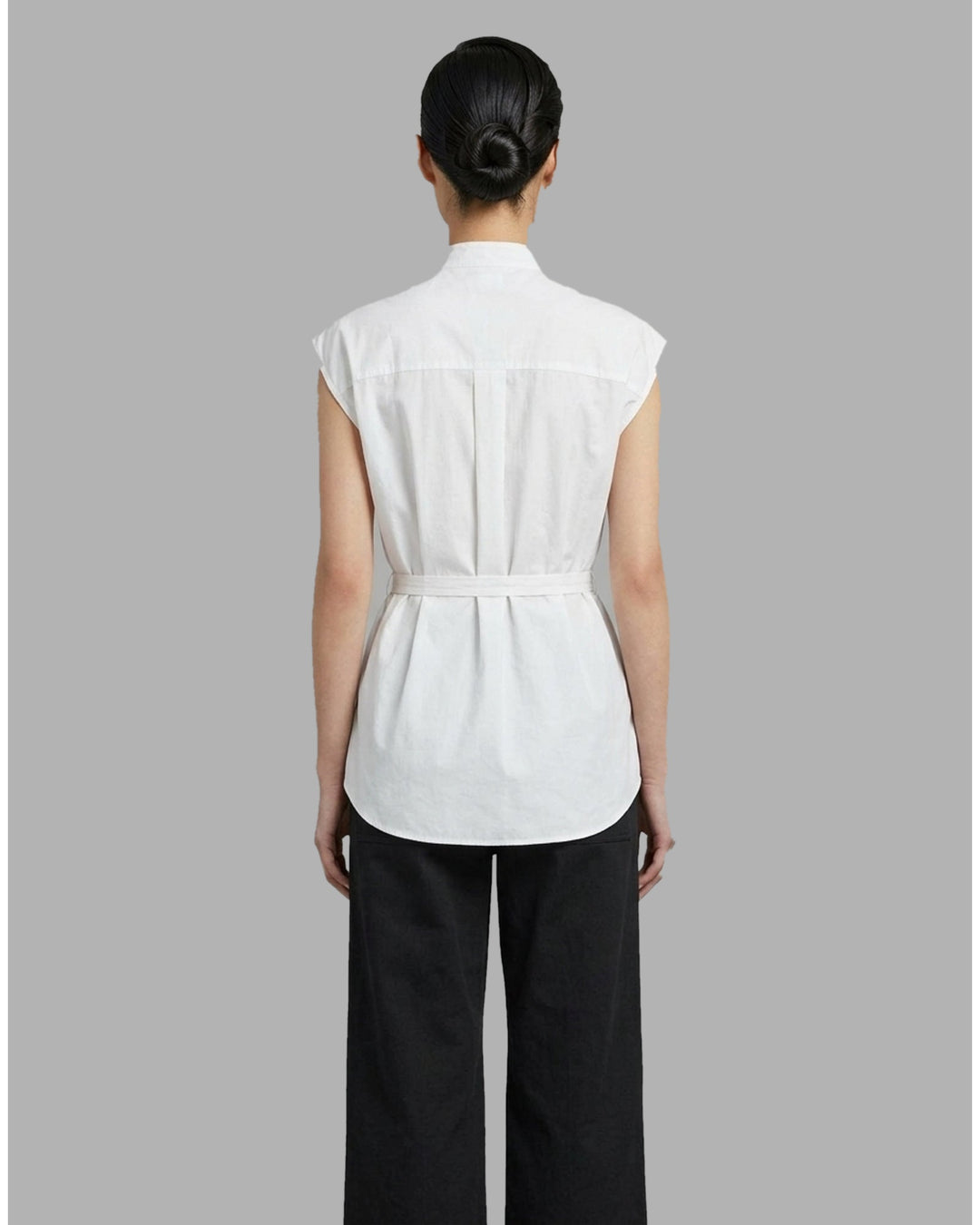 Black sleeveless cotton shirt with pintucked bib front, mandarin collar and self-fabric waist tie - back