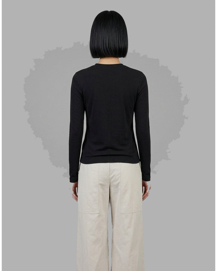Black long sleeve zip-front top in high stretch modal jersey with a crew neckline and vertical front seams - back