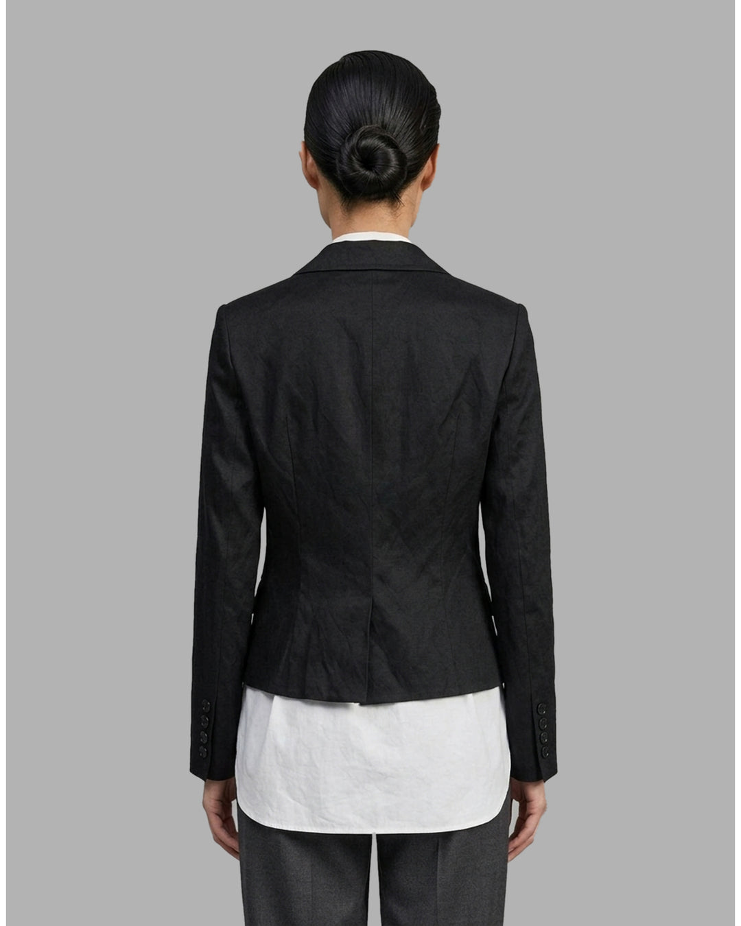 Black cropped blazer with wide notched lapels, flap pockets and a crinkled finish from Club21 Collection - back