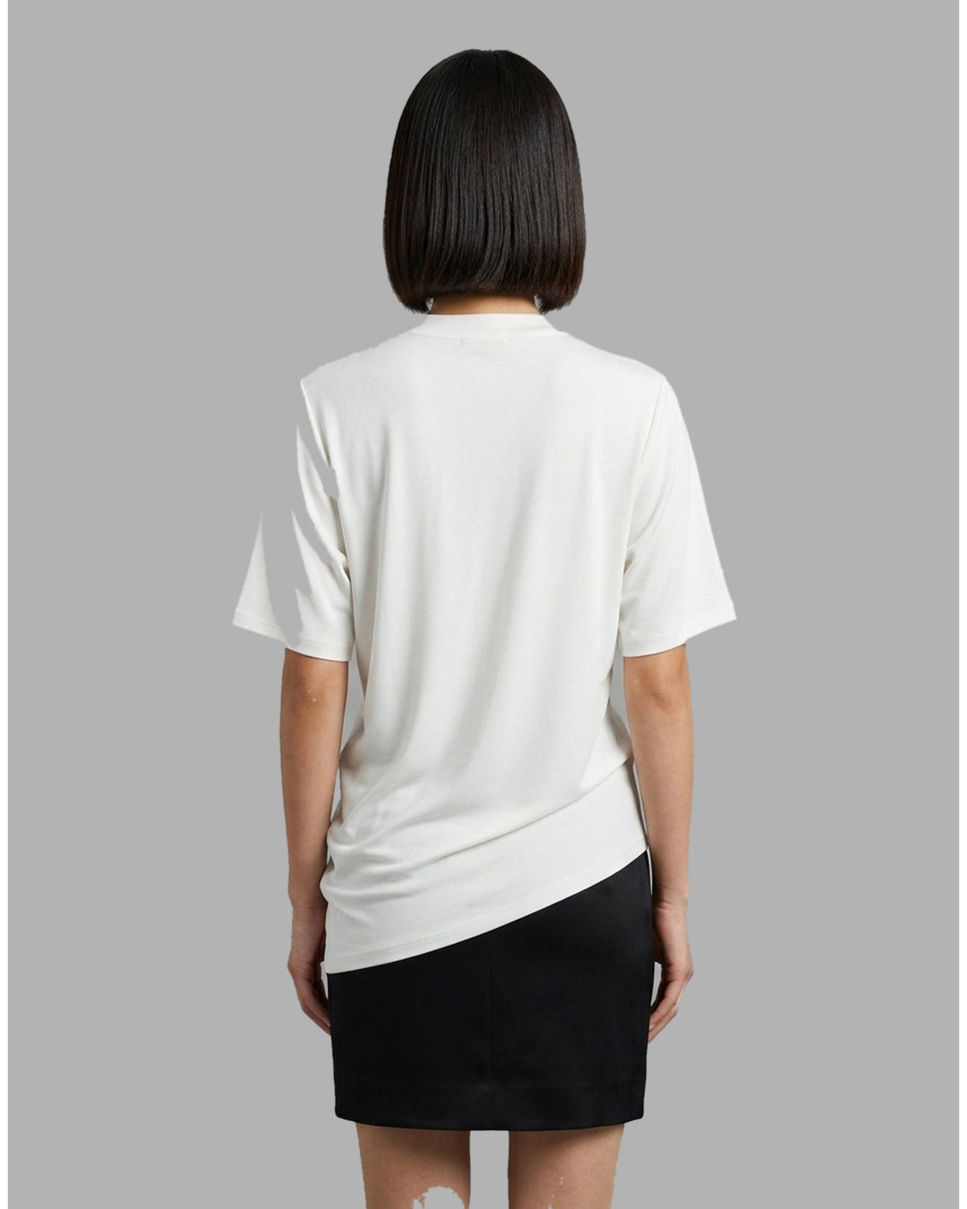Black short-sleeve crew neck jersey tee with gathered side draping and an asymmetric hem, shown flat against a white background - back