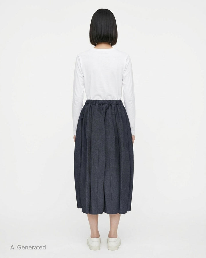 Comme des Garçons Comme des Garçons voluminous cocoon midi skirt in charcoal grey with elasticated drawstring waist and gathered sculptural silhouette, displayed flat on white background - back