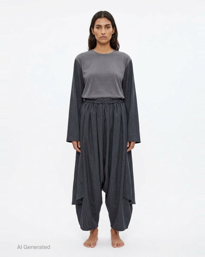 Comme des Garçons Comme des Garçons wide-leg cropped pants in dark charcoal with gathered skirt overlay and elasticated ruched waistband, front view - front