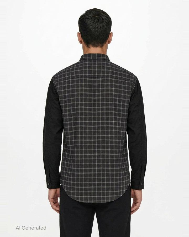 Comme des Garçons Homme long sleeve shirt with dark windowpane check cotton body and contrast solid black cotton broad cloth sleeves, shown flat on a white background - back