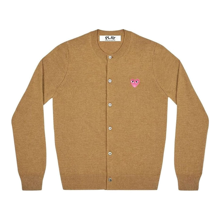 Comme des Garçons PLAY black round neck cardigan with embroidered pink heart emblem patch and button-through front fastening, flat lay view - packshot