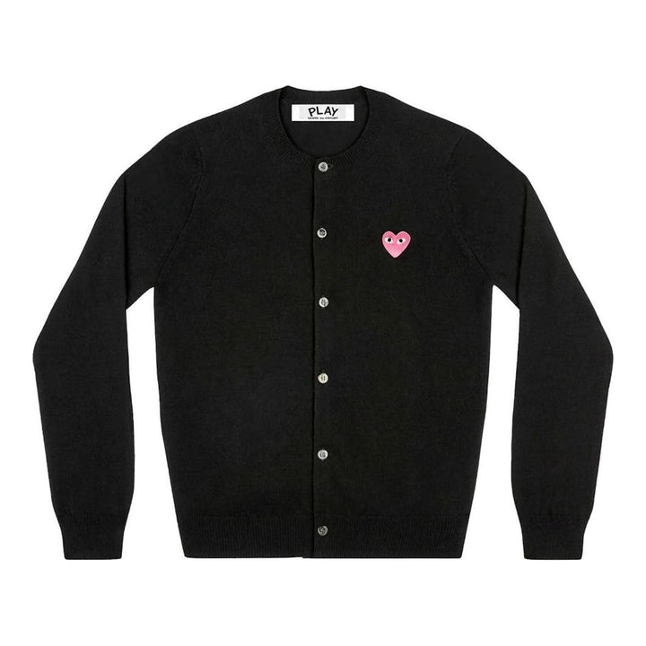 Comme des Garçons PLAY black round neck cardigan with embroidered pink heart emblem patch and button-through front fastening, flat lay view - packshot
