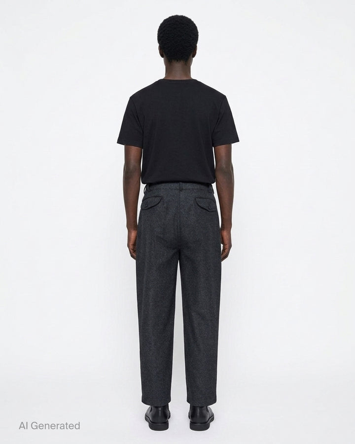 Charcoal heathered relaxed tapered pants with pleated front and button closure by Comme des Garçons Shirt - back