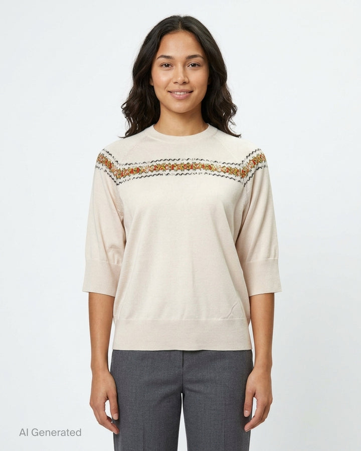 Dries Van Noten cream knit top with three-quarter sleeves, mock neck, and a multicolour Fair Isle jacquard yoke band featuring red, green, and black floral motifs - front