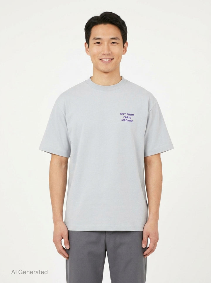 Drôle de Monsieur Not From Paris Madame pale grey oversized cotton tee with purple slogan print on the chest - front