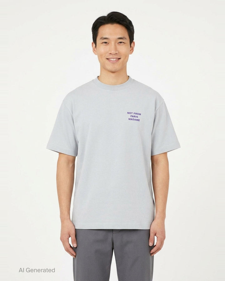Drôle de Monsieur Not From Paris Madame pale grey oversized cotton tee with purple slogan print on the chest - front