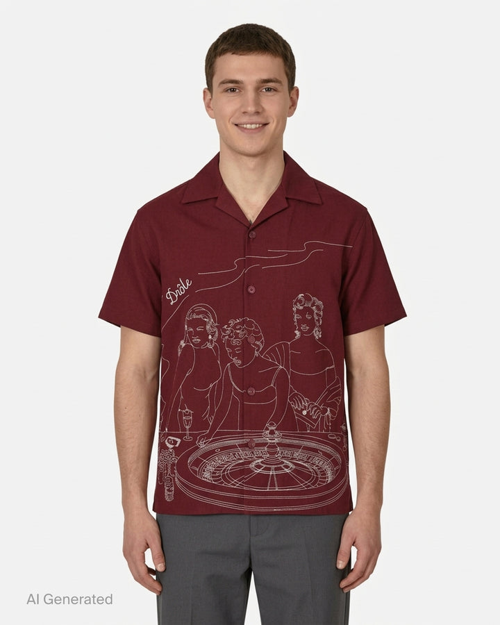 Drôle de Monsieur burgundy short sleeve camp collar shirt with white embroidered illustration of three women at a roulette table - front
