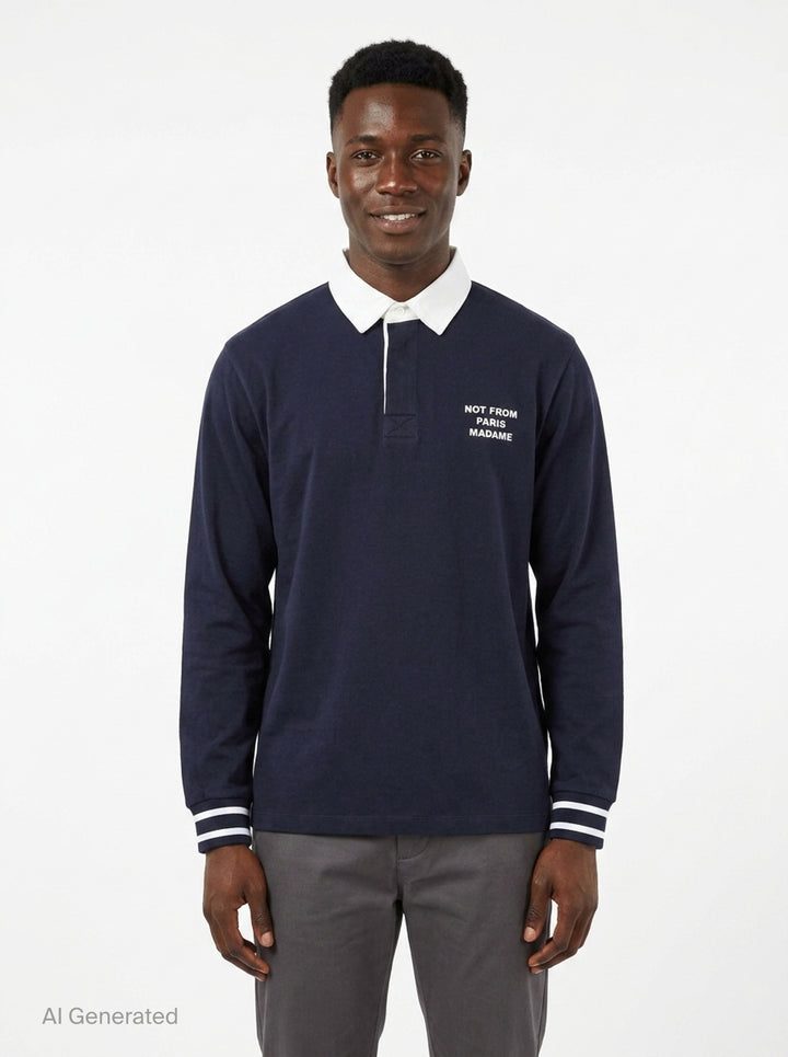 Drôle de Monsieur Slogan Long Sleeve Polo in navy with contrast white collar, striped ribbed cuffs, and 'Not From Paris Madame' chest embroidery - front