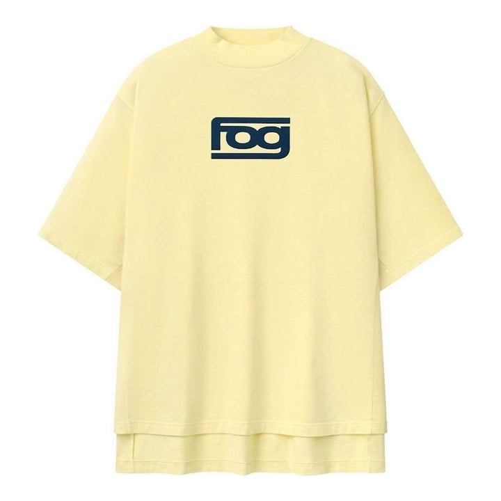 Fear of God ESSENTIALS Panelled Modern Tee in deep teal with a yellow logo graphic at the chest, shown from the front - packshot