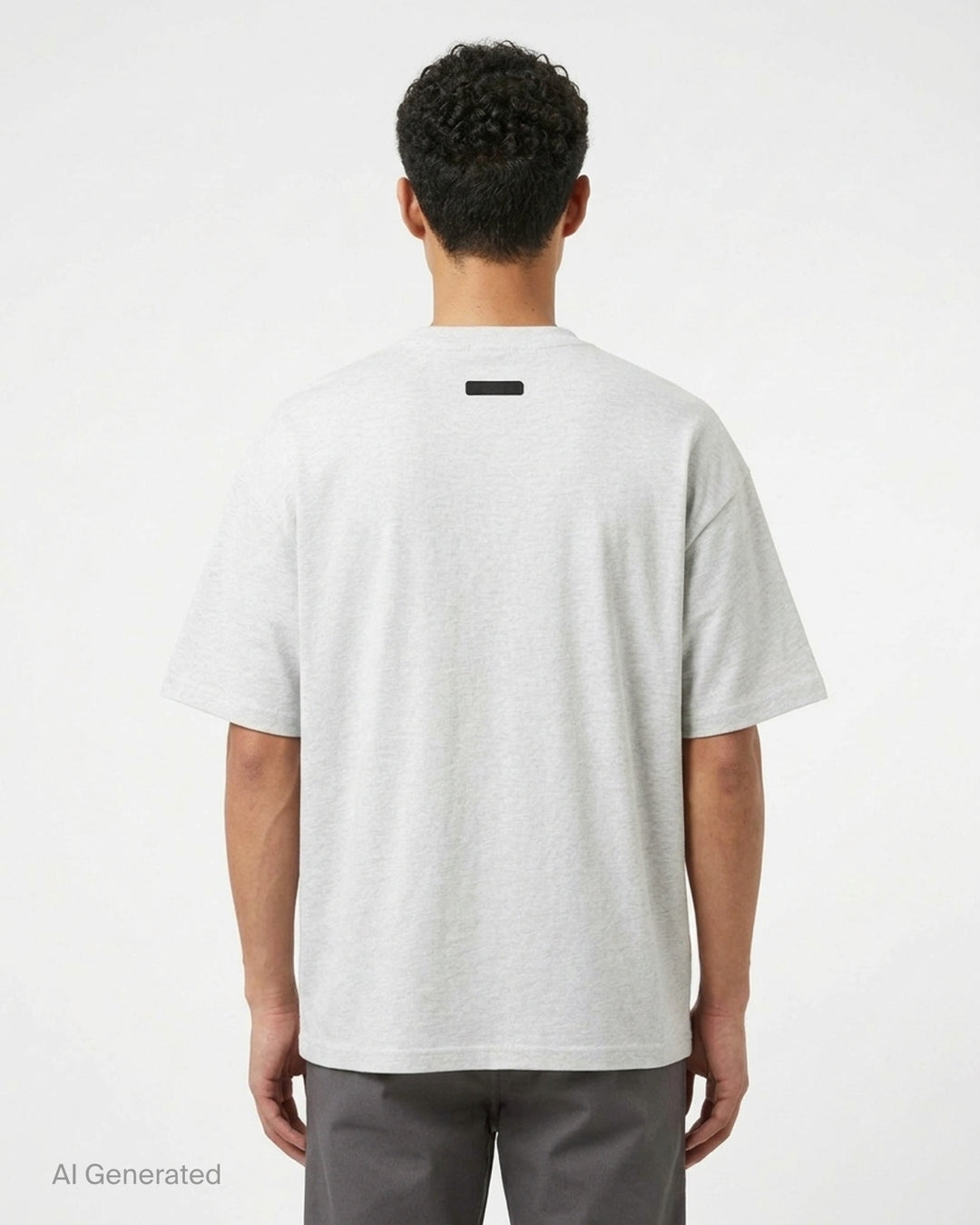 Fear of God Essentials Signature Short Sleeve Tee in washed grey, featuring an oversized boxy silhouette, ribbed crewneck, and tonal script logo at the chest - back