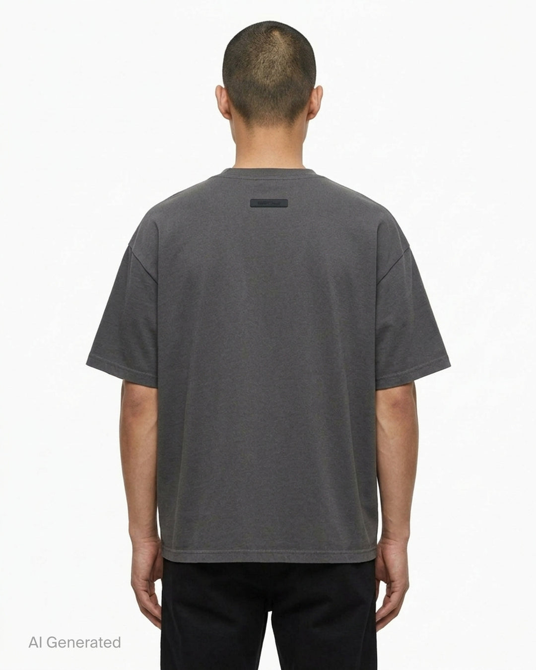Fear of God Essentials Signature Short Sleeve Tee in washed grey, featuring an oversized boxy silhouette, ribbed crewneck, and tonal script logo at the chest - back