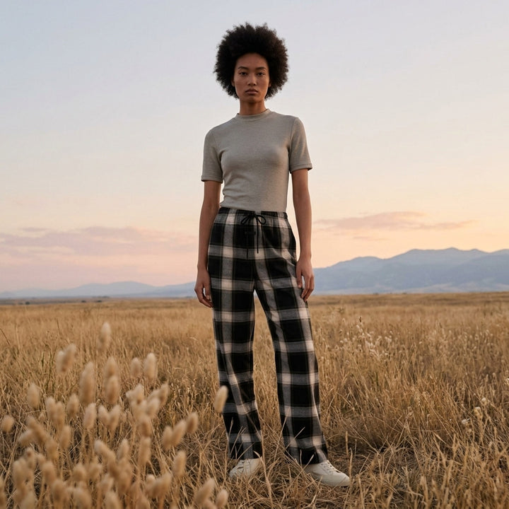 Fear of God Essentials women's tight tee in heathered taupe-grey with mock neckline and short sleeves, shown flat against a white background - lifestyle
