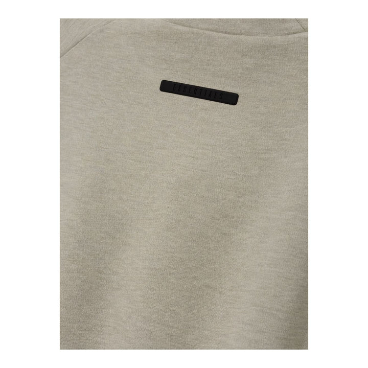 Fear of God Essentials women's tight tee in heathered taupe-grey with mock neckline and short sleeves, shown flat against a white background - packshot