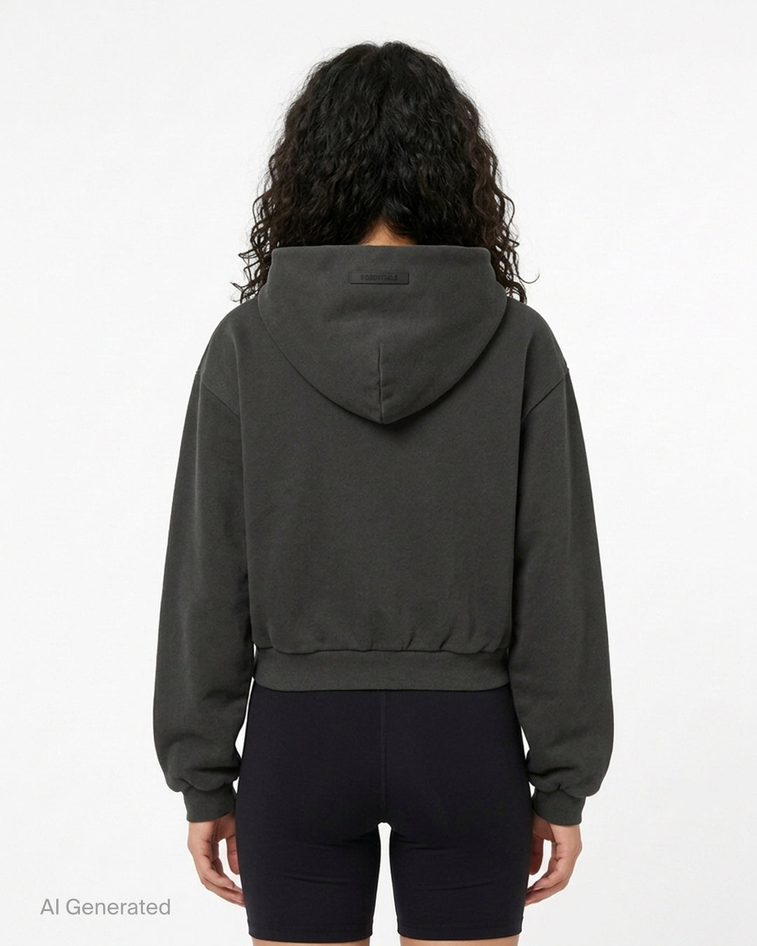 Fear of God Essentials women's modern cropped zip hoodie in washed black with embroidered script Essentials logo on the chest and front hand pockets - back