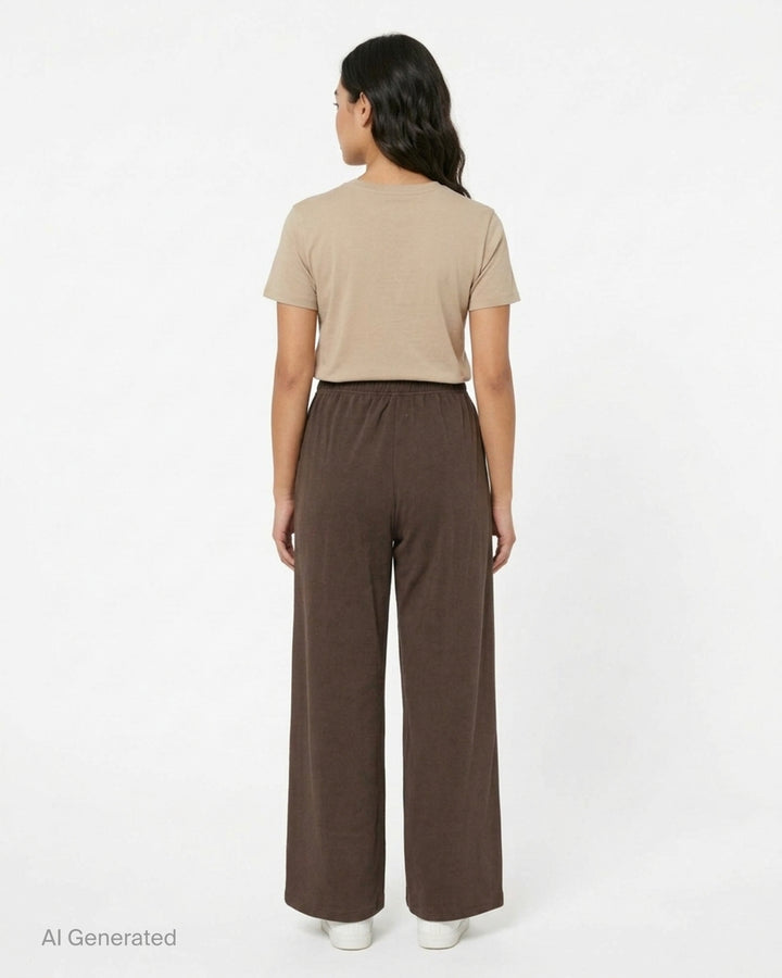 Glowny Button Fly Wide Leg Pants in black, featuring an elasticated waistband, three-button fly placket, wide-leg silhouette, and woven brand label tab at the hip - back