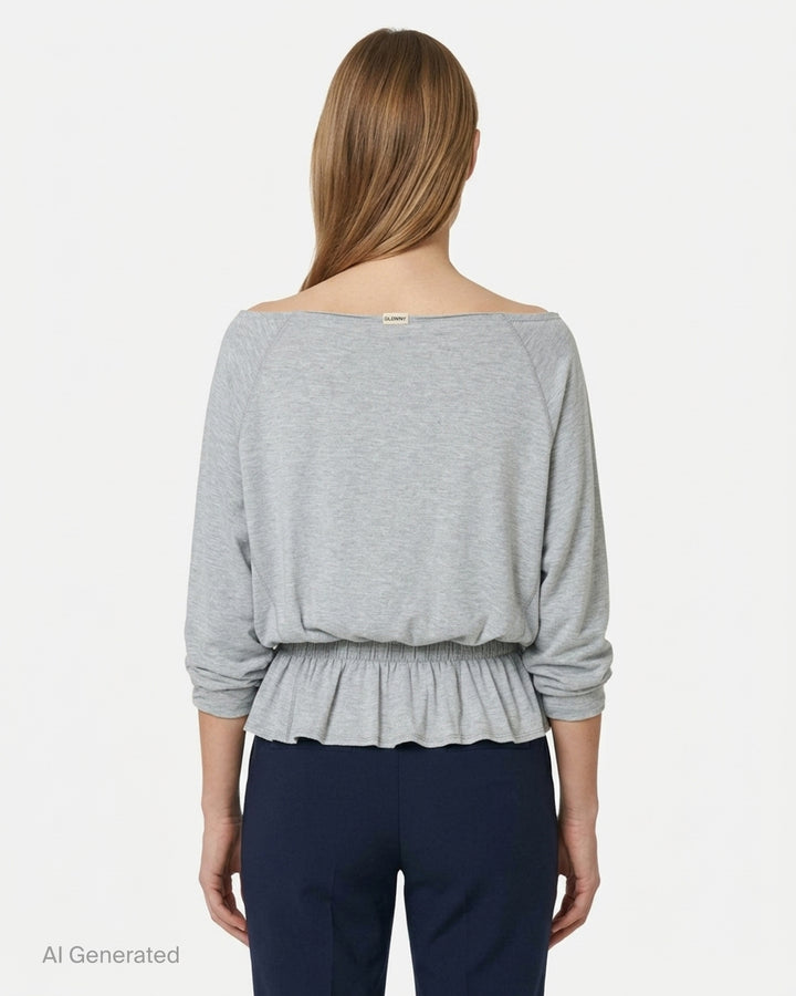 Glowny Sway Shirring Long Sleeve Blouse in heather grey, featuring a relaxed batwing silhouette, broad boat neckline, and an elasticated shirred frill hem - back