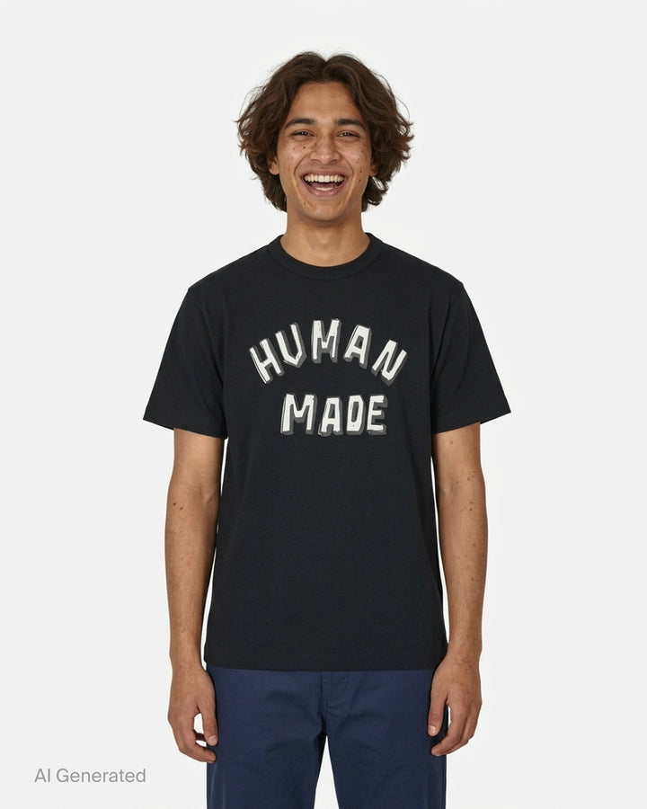 Human Made black short sleeve graphic t-shirt with white and grey hand-drawn arched logo print on the chest - front