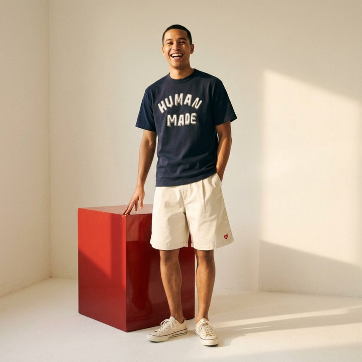 Human Made black short sleeve graphic t-shirt with white and grey hand-drawn arched logo print on the chest - lifestyle