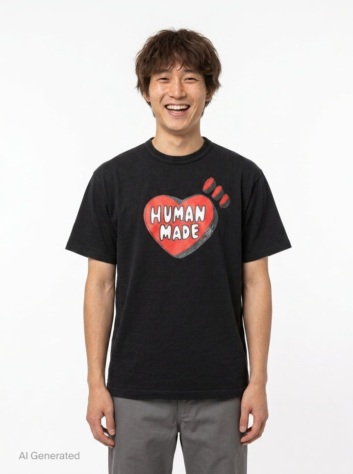 Human Made black short sleeve crew neck t-shirt with a large red hand-drawn heart graphic and 'Human Made' bubble lettering on the chest - front