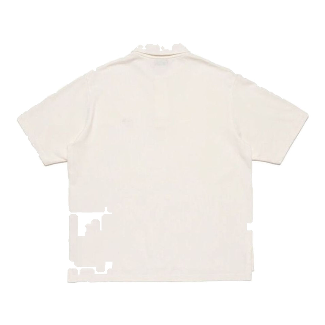 Human Made Short Sleeve Polo Shirt in navy piqué cotton with embroidered heart-and-arrow logo at the chest and two-button snap placket, laid flat on white background - packshot