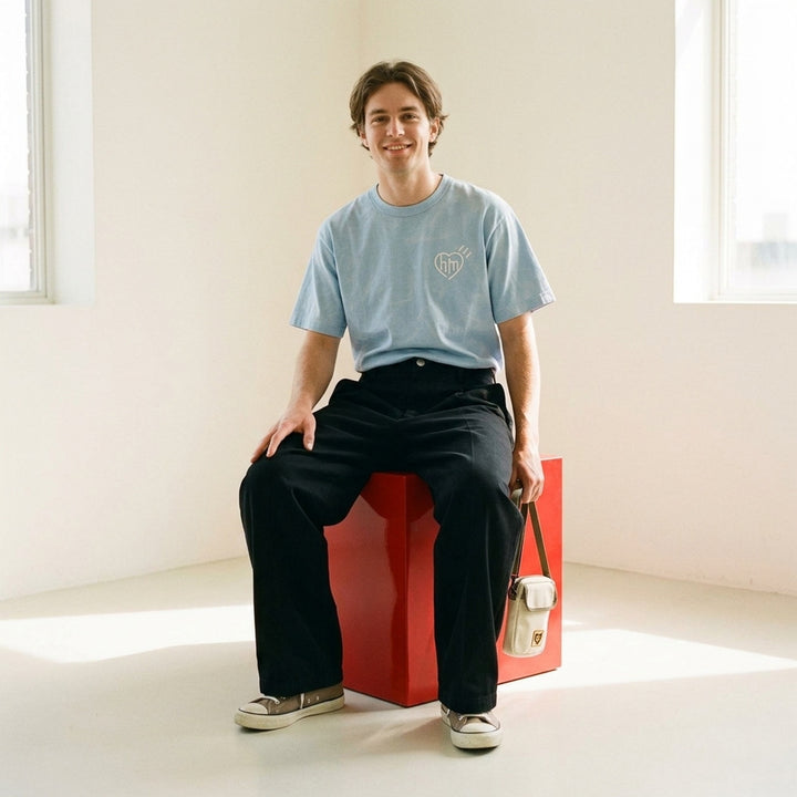 Human Made Skater Wide Leg Pants in black, featuring a high-rise waistband, double front pleats, and a relaxed wide-leg silhouette with stitched crease detail - lifestyle