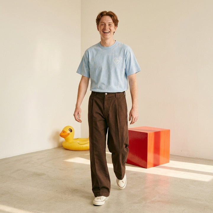 Human Made Skater Wide Leg Pants in black, featuring a high-rise waistband, double front pleats, and a relaxed wide-leg silhouette with stitched crease detail - lifestyle