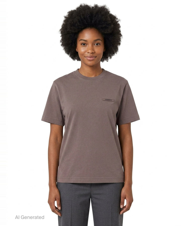 Jacquemus Gros Grain Short Sleeve Tee in cream with a woven grosgrain logo label on the chest - front