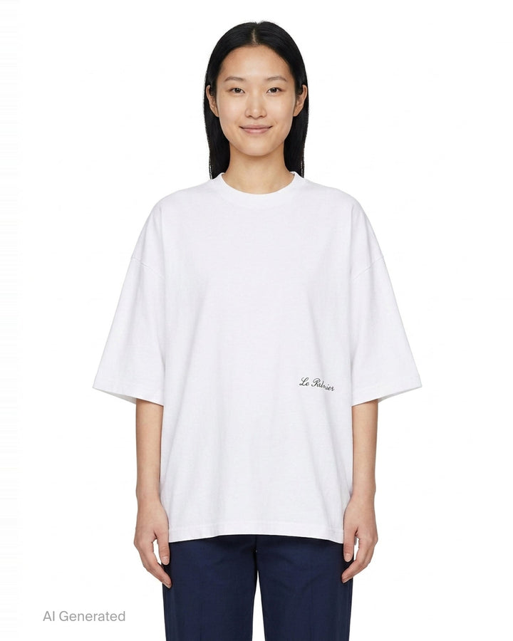 Jacquemus Le Palmier oversized white cotton tee with drop shoulders and 'Le Palmier' script embroidery at the hem, product flat lay - front