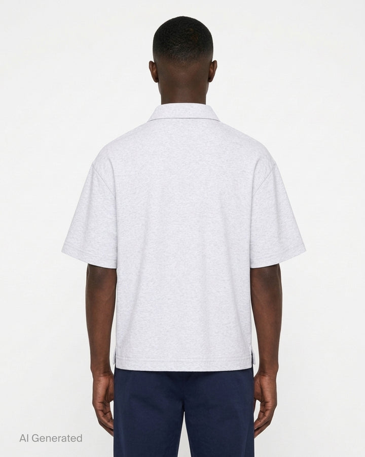 Jacquemus Le Polo Ruban in heather grey with a pointed collar, two-button placket and woven ribbon label at the hem - back