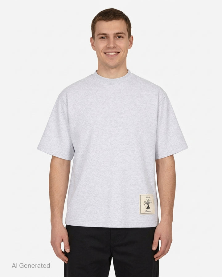 Jacquemus Le T-shirt Torneo short sleeve tee in taupe with a woven botanical label at the hem - front