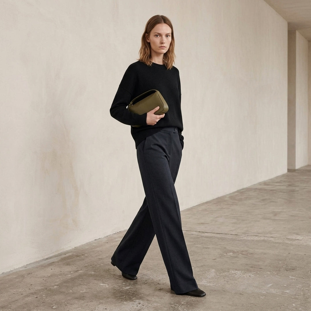 Jil Sander wide-leg stretch wool trousers in taupe with front creases, double-button waist, and belt loops, styled flat on a white background - lifestyle