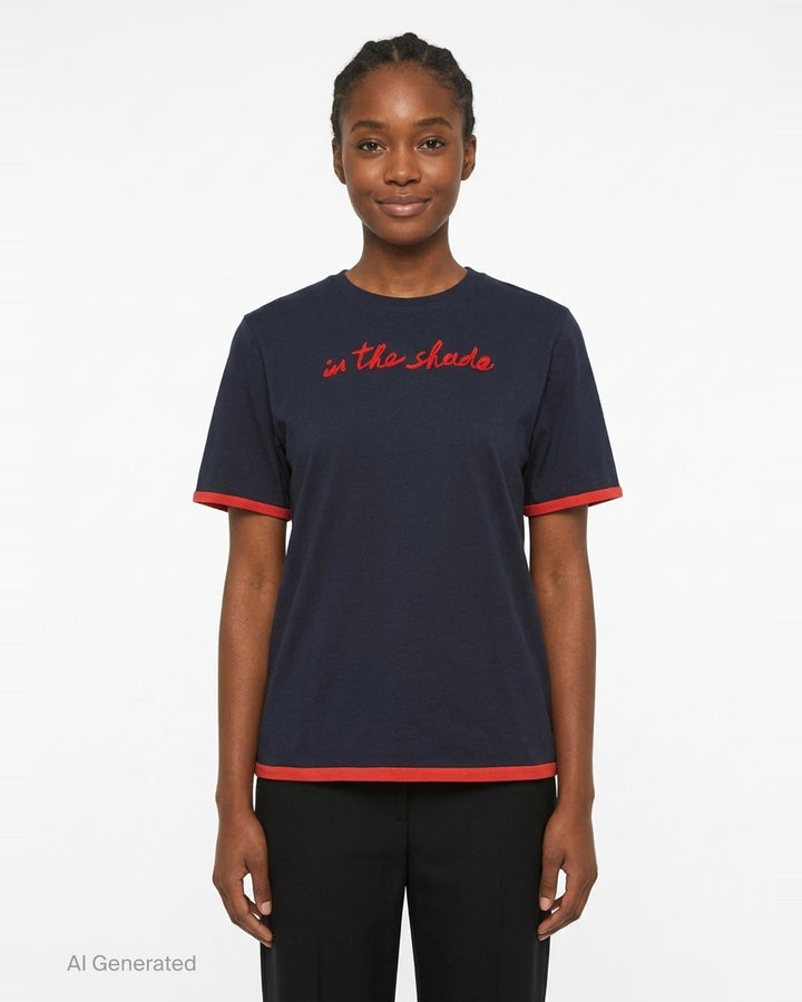 JW Anderson navy short sleeve t-shirt with red cursive 'in the shade' chest embroidery and contrast red sleeve and hem trim detailing - front