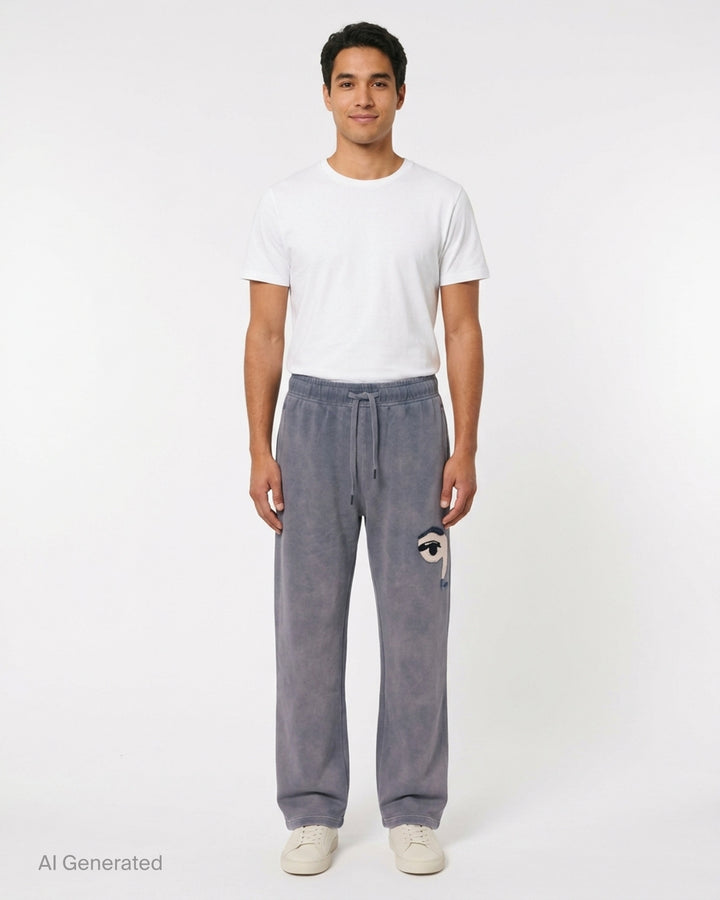 KidSuper Studios Face Sweatpants in washed lavender-grey with an appliqué eye patch and drawstring waist - front