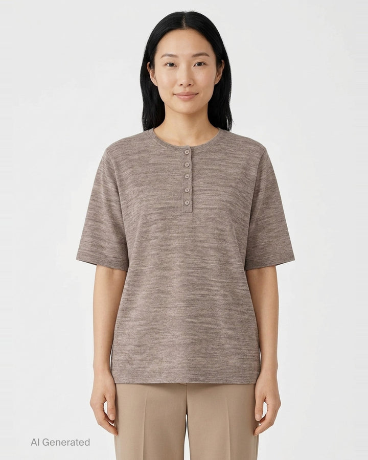 Lauren Manoogian Fine Henley knit top in heathered taupe with short sleeves, a round neck, and a partial button placket, shown flat on a white background - front